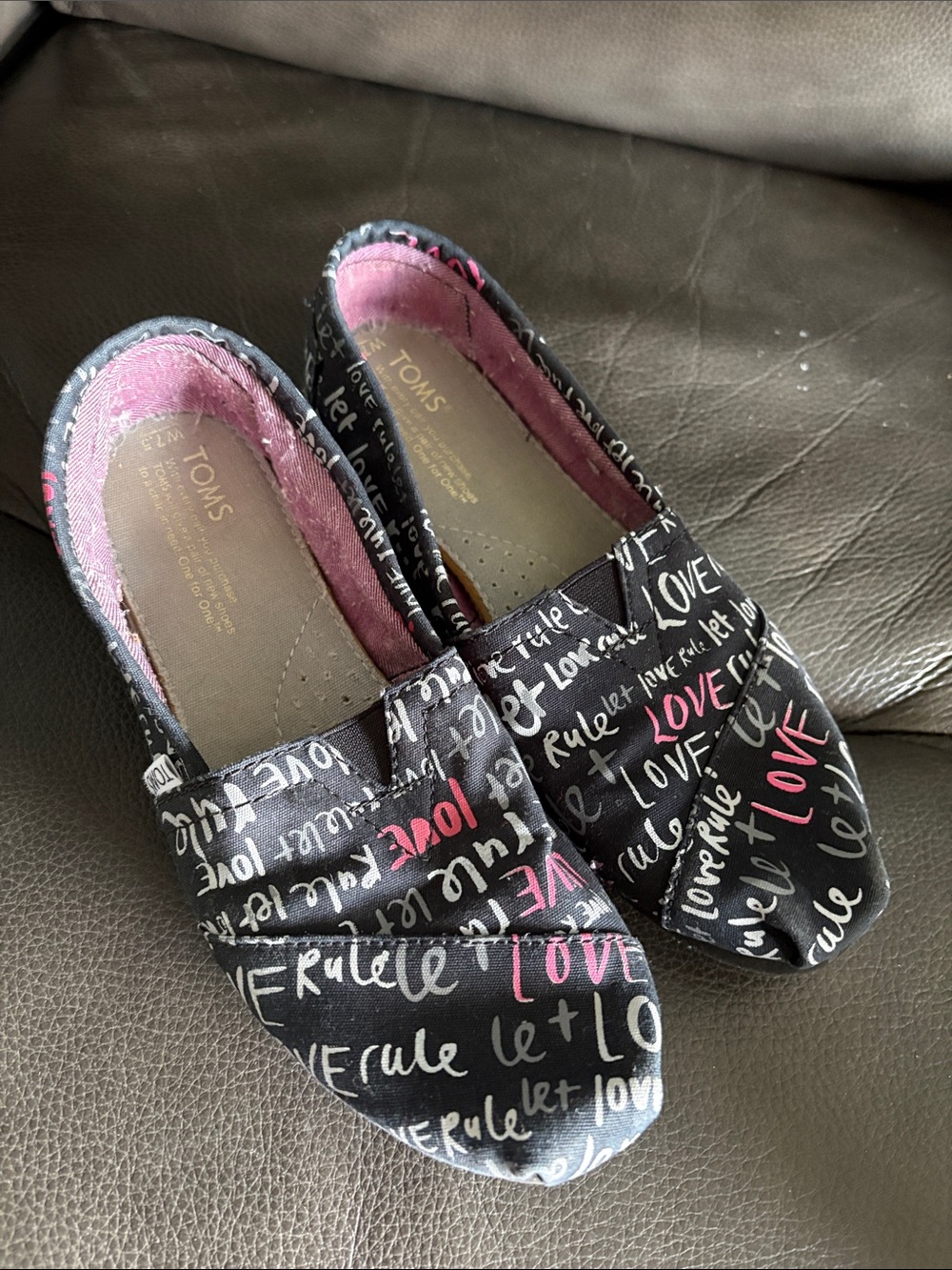 Toms Black Slip-On Flats with Pink Script 'Love'